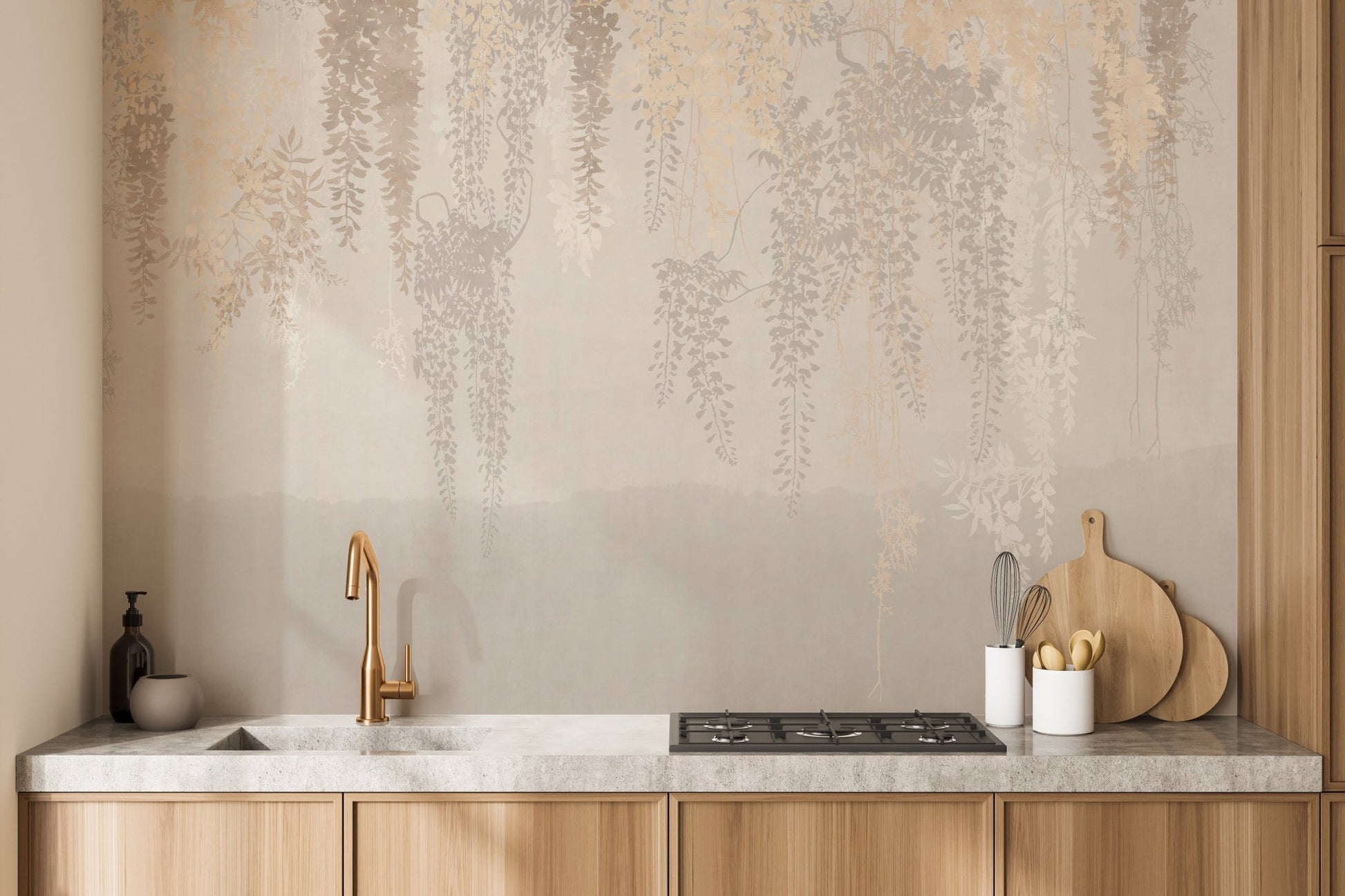 Subtle beige leaf wall mural as a kitchen backsplash behind a countertop.
