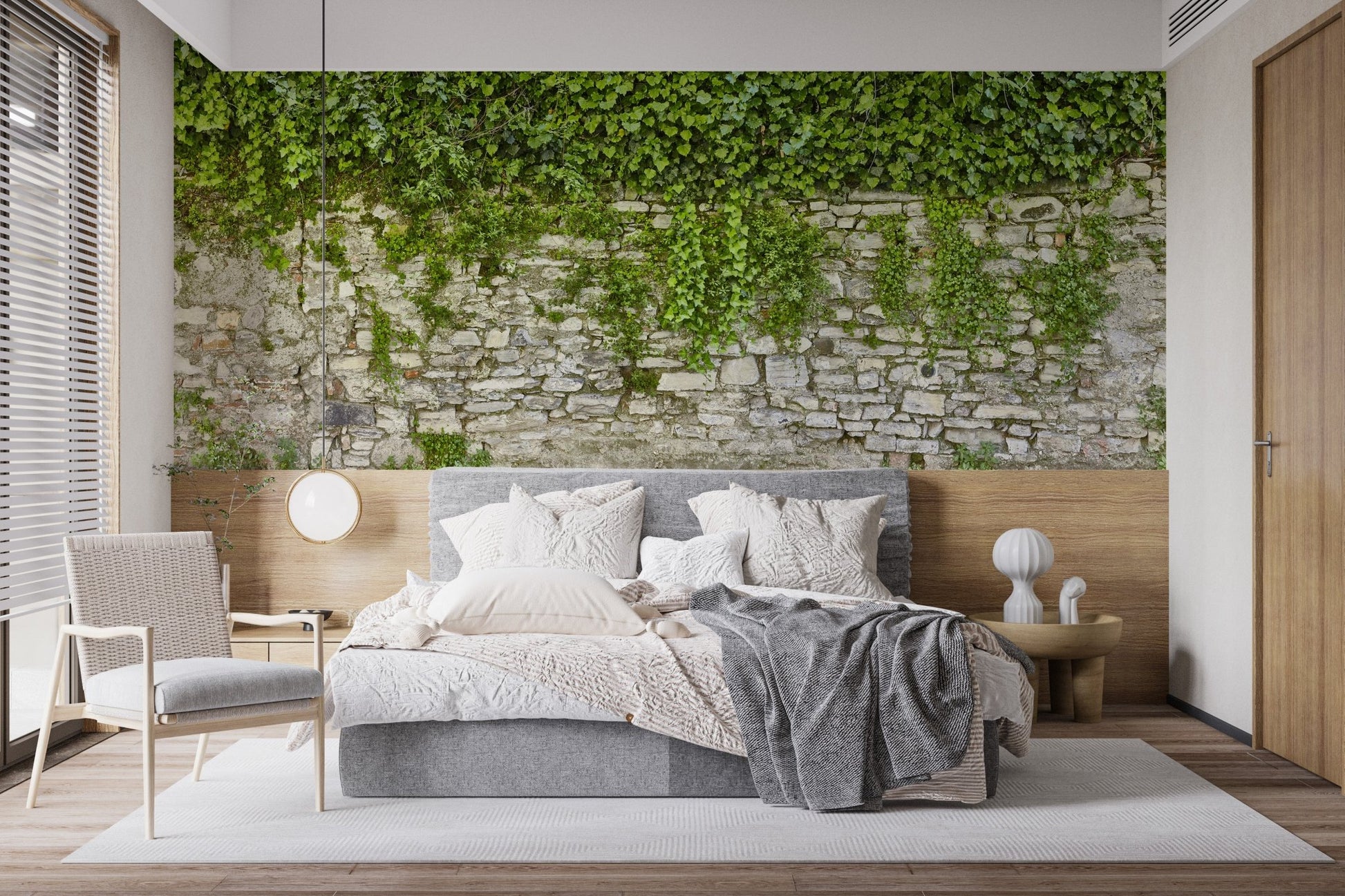 Stone wall and ivy leaves wallpaper mural in a modern bedroom with neutral bedding.