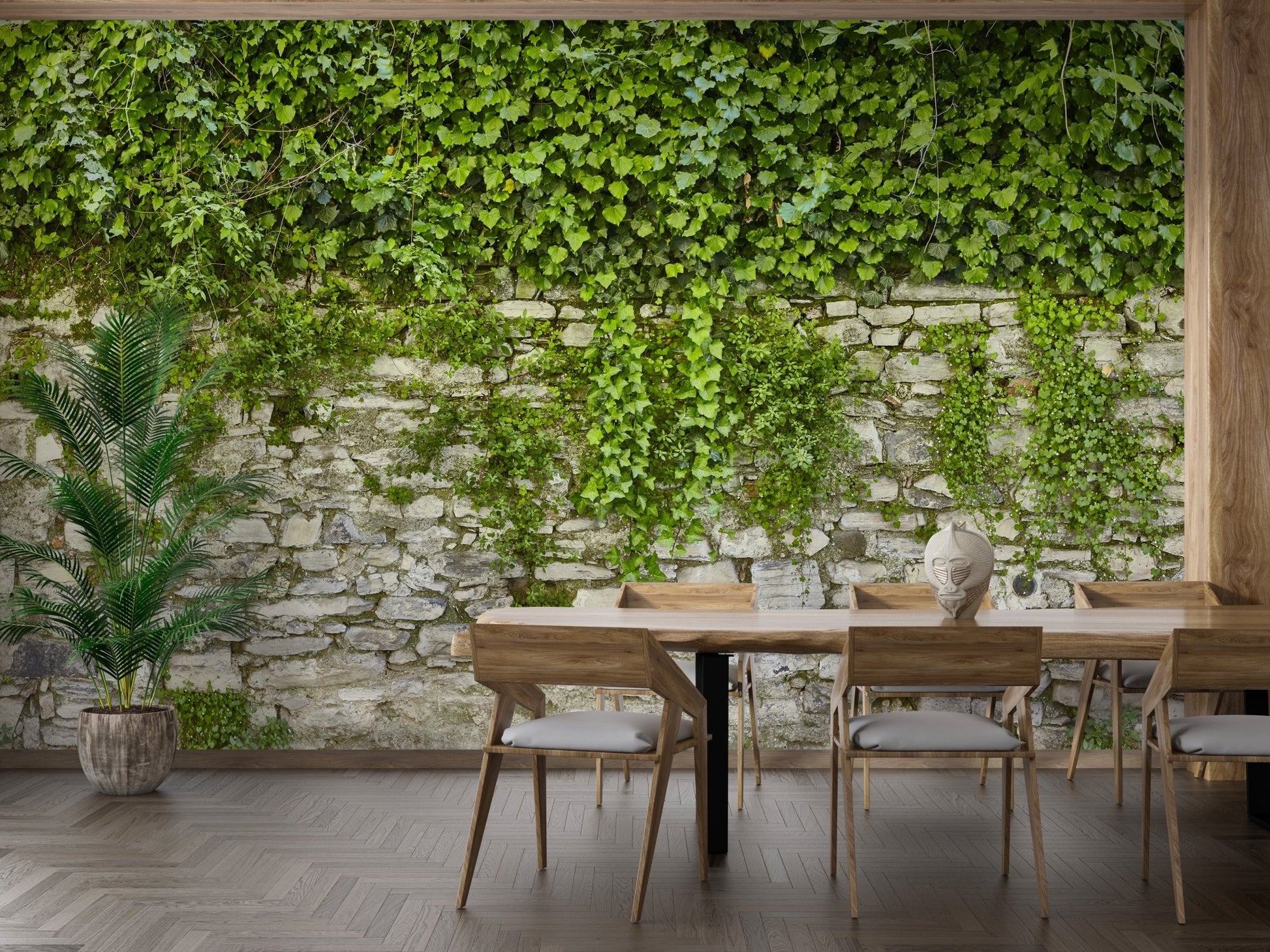 Rustic stone and greenery wallpaper mural in a dining room with wooden chairs.