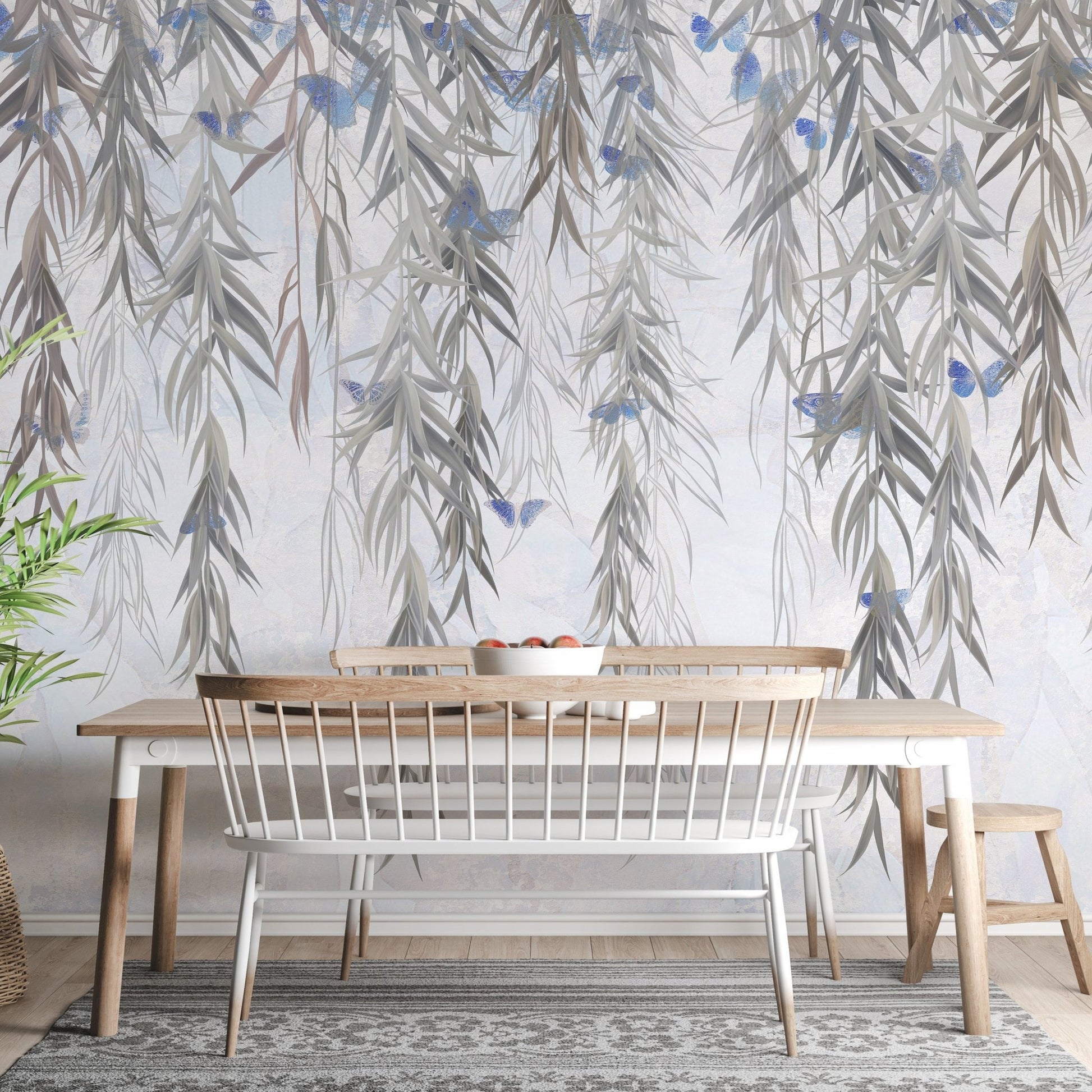 Willow pattern wall mural in small dining room with hanging flower.