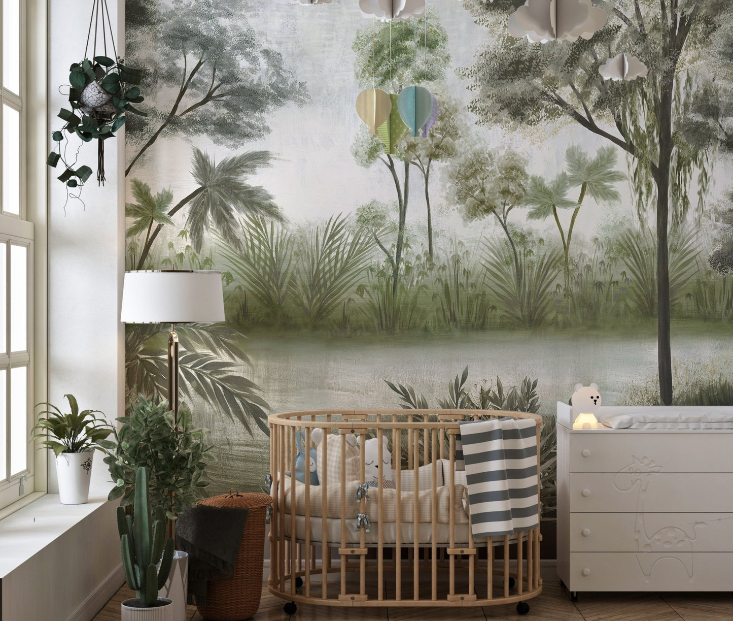 Hazy Forest Wall Mural with green trees behind a baby crib in toddler room.