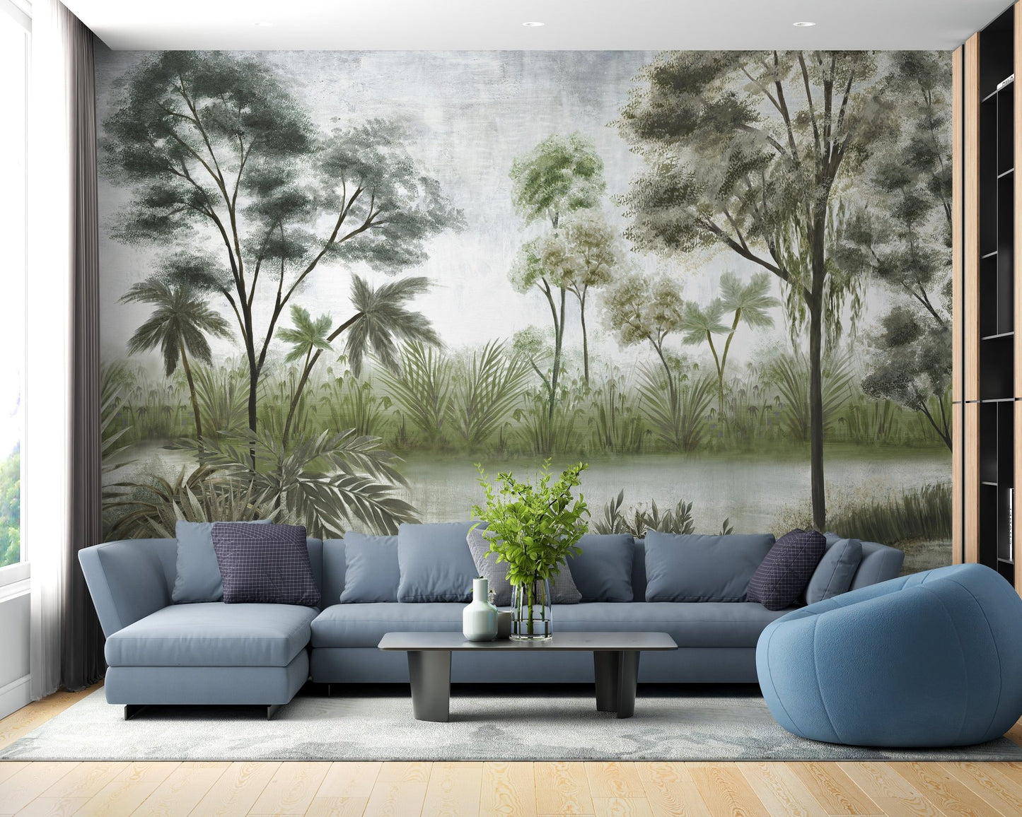 Misty lake and forest wall mural in a living room with a blue sofa.
