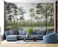 Misty lake and forest wall mural in a living room with a blue sofa.