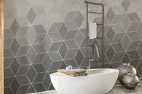 Hexagon Concrete Charm wall mural in a minimalist bathroom with white oval tub.