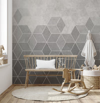 Grey geometric wall mural in a kids' nursery with a wooden rocking horse.