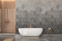 Hexagon Concrete Charm wall mural behind a white bathtub in a modern bathroom.
