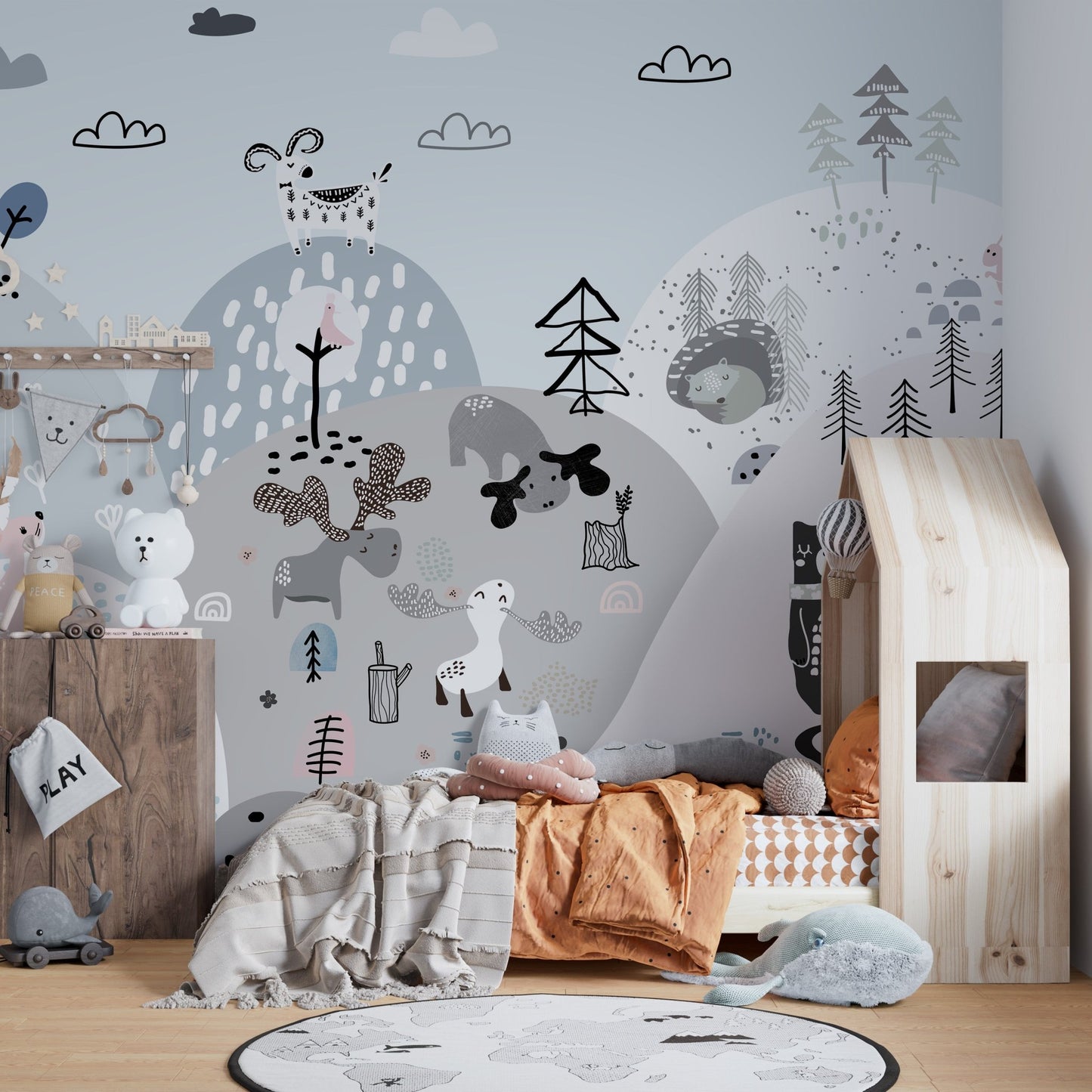 Playful hillside mural featuring colorful cartoon creatures in kids bedroom.
