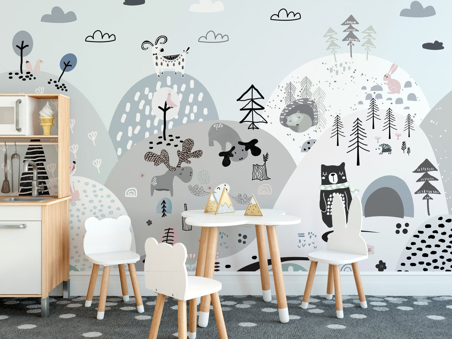 Whimsical mural featuring cartoon creatures on a grassy hillside in kids dining area.
