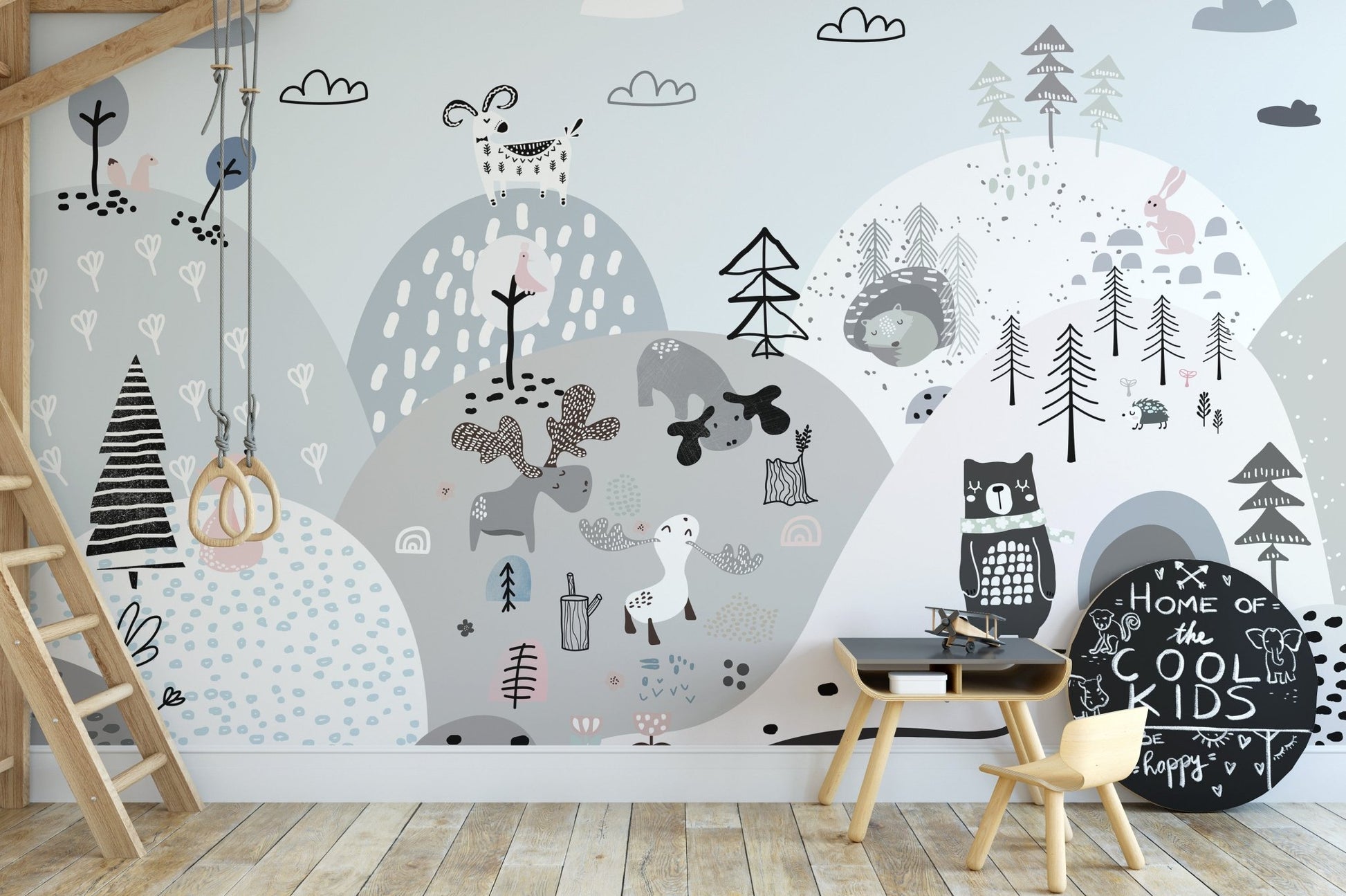 Artistic mural with cartoon creatures on a lively hillside in study area.
