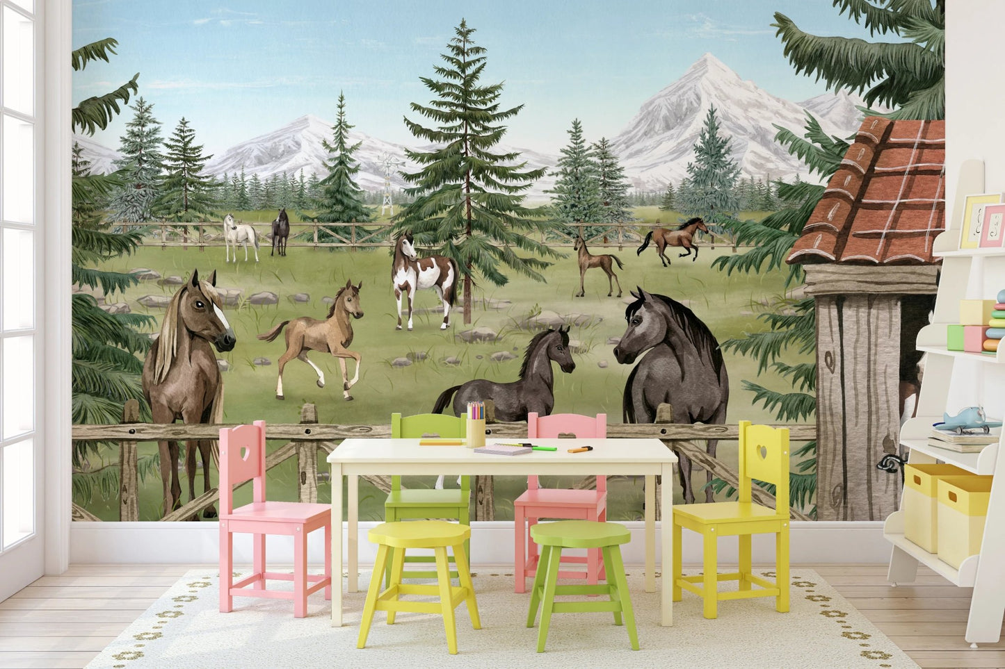Colorful playroom wall mural with a horse theme and yellow and green plastic chairs.