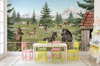 Colorful playroom wall mural with a horse theme and yellow and green plastic chairs.
