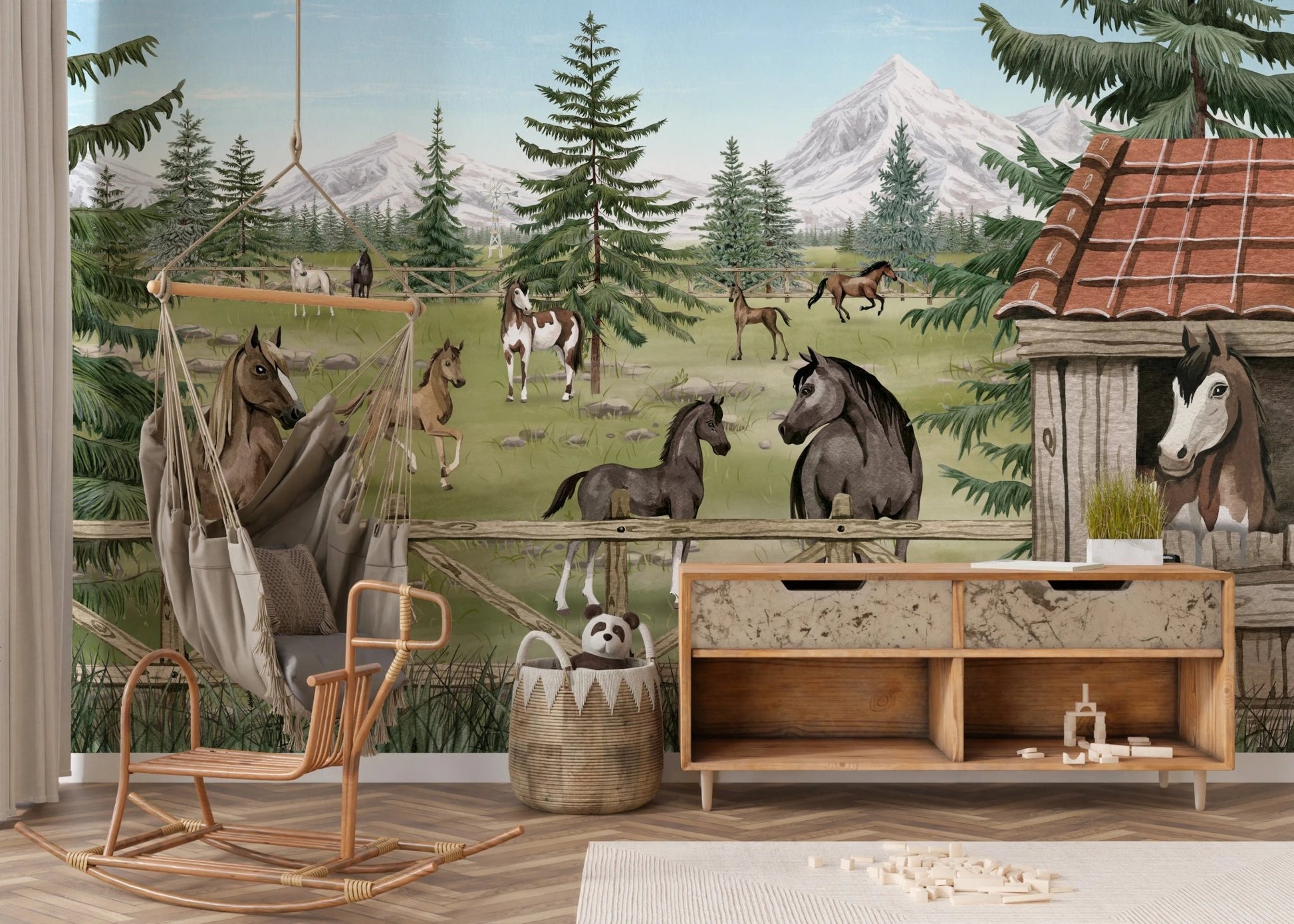 Farm life wall mural featuring horses and a barn in a room with a rocking chair.