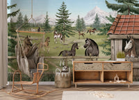 Farm life wall mural featuring horses and a barn in a room with a rocking chair.