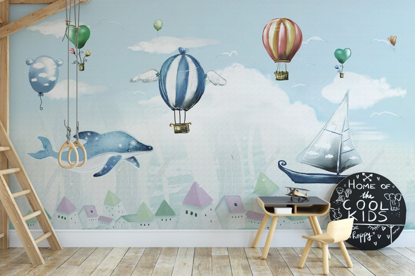 Watercolor hot air balloon wall mural in kids room with wooden chair.