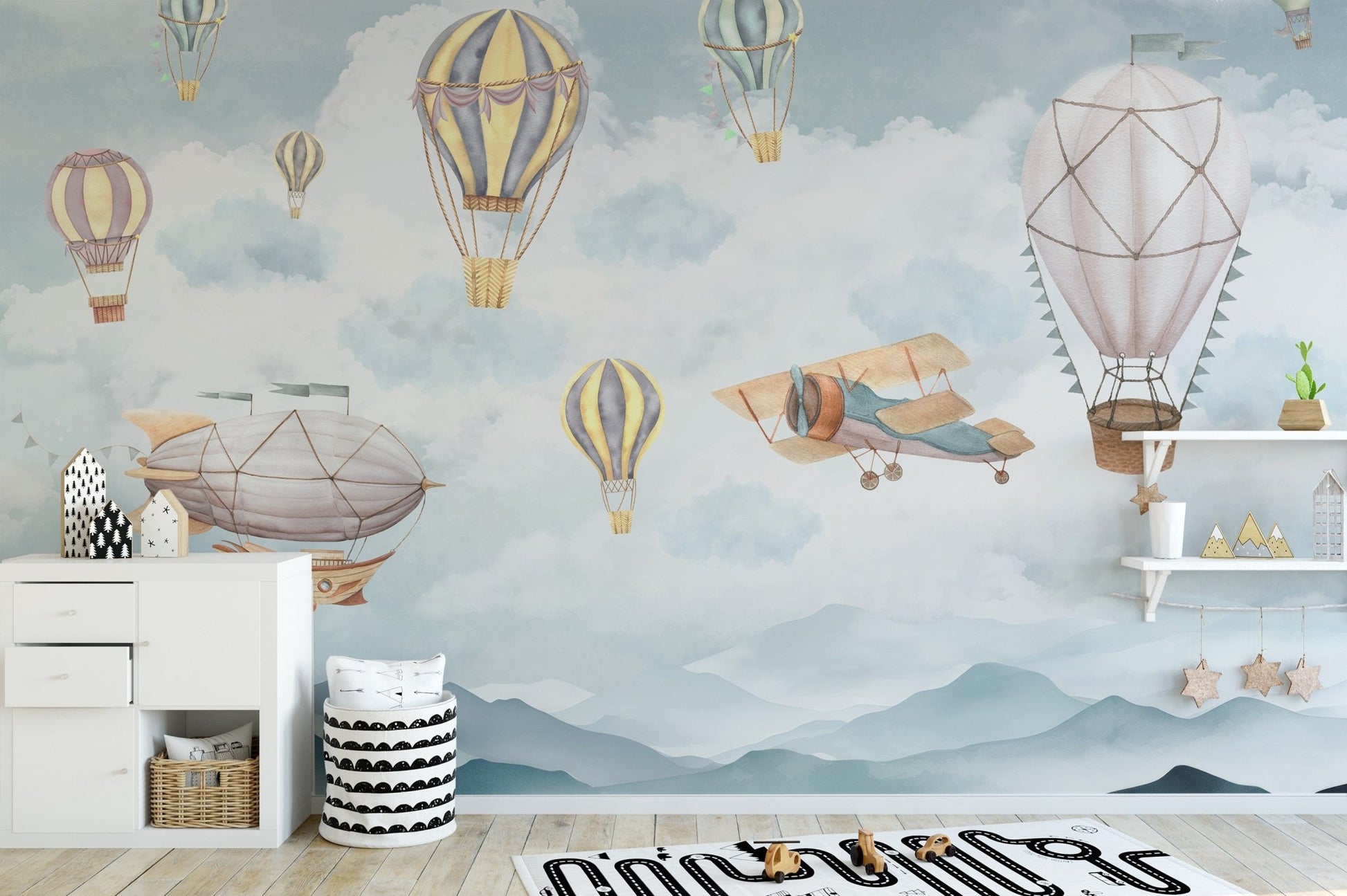 Vintage airship and balloon wallpaper with cloudy sky design.