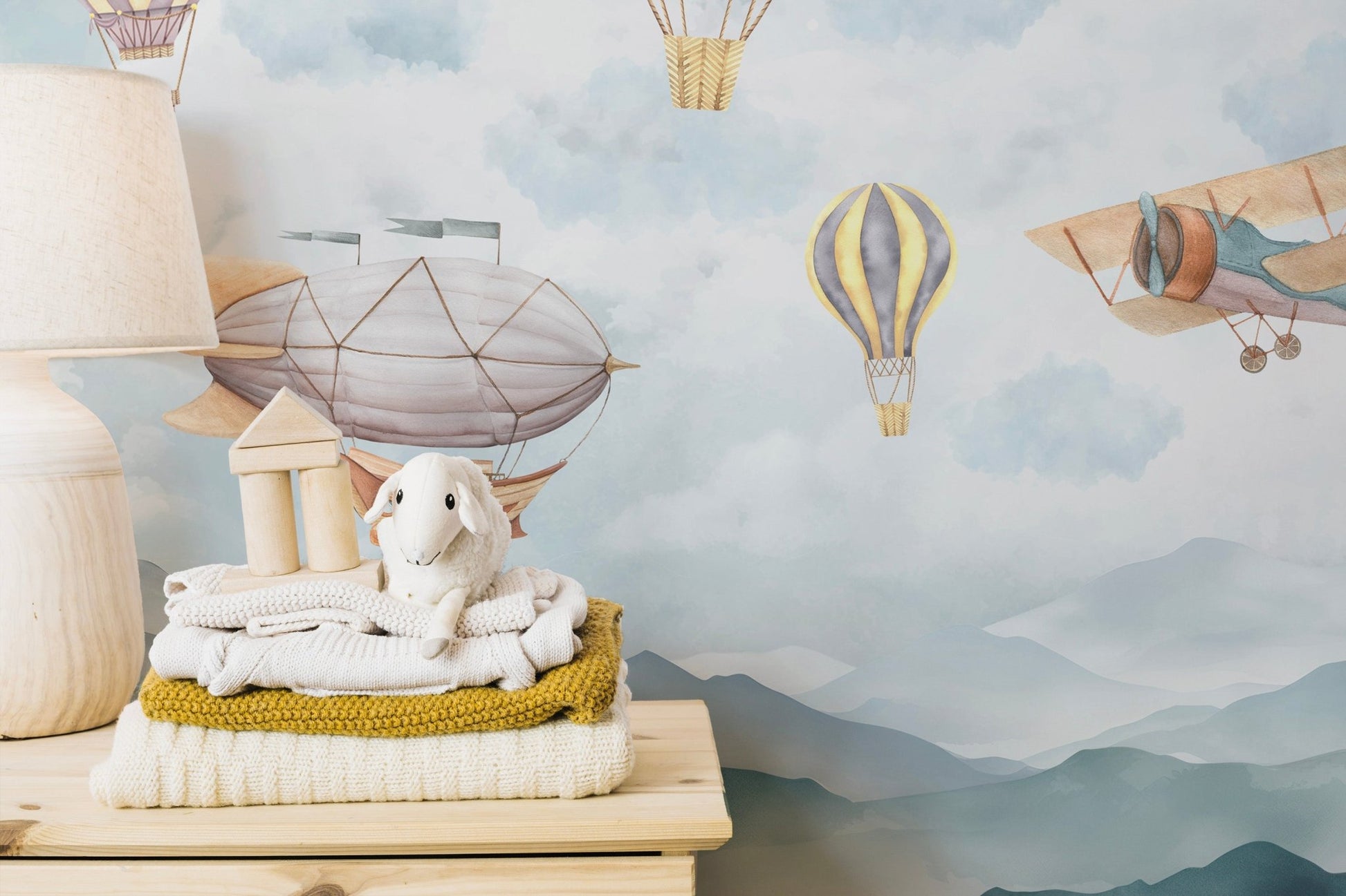 Pastel aviation wall mural with balloons and small airplane.