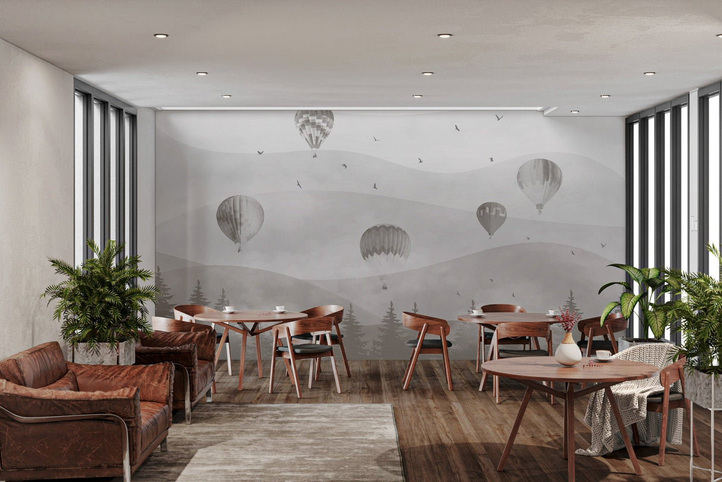 Gray-themed mural with balloons and forest scene in restaurant.
