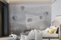 Vintage style hot air balloon wall mural in a large bedroom interior space.