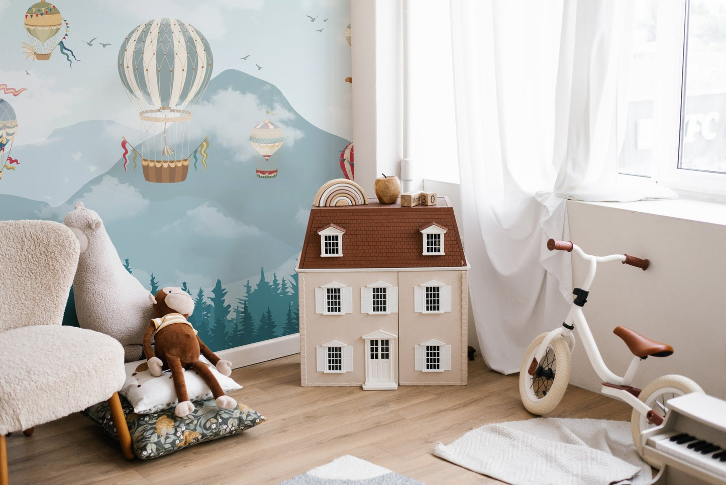 Whimsical Balloon Wall Mural for minimalist children's playroom.