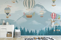 Alpine forest wall mural in a playroom with floating balloons.