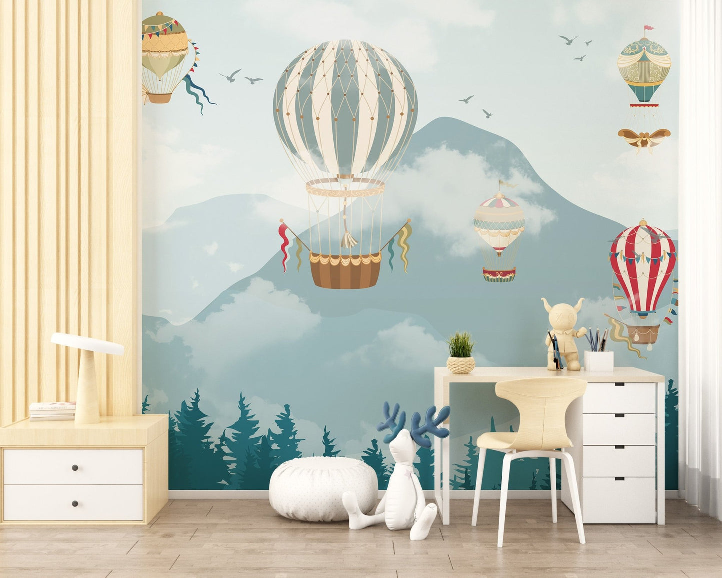 Blue mountain and balloon wall mural in a study area.
