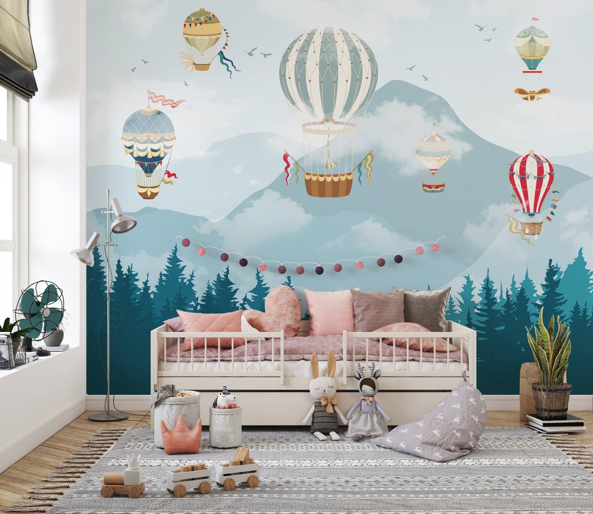 Hot air balloon wall mural in a sunlit nursery. 