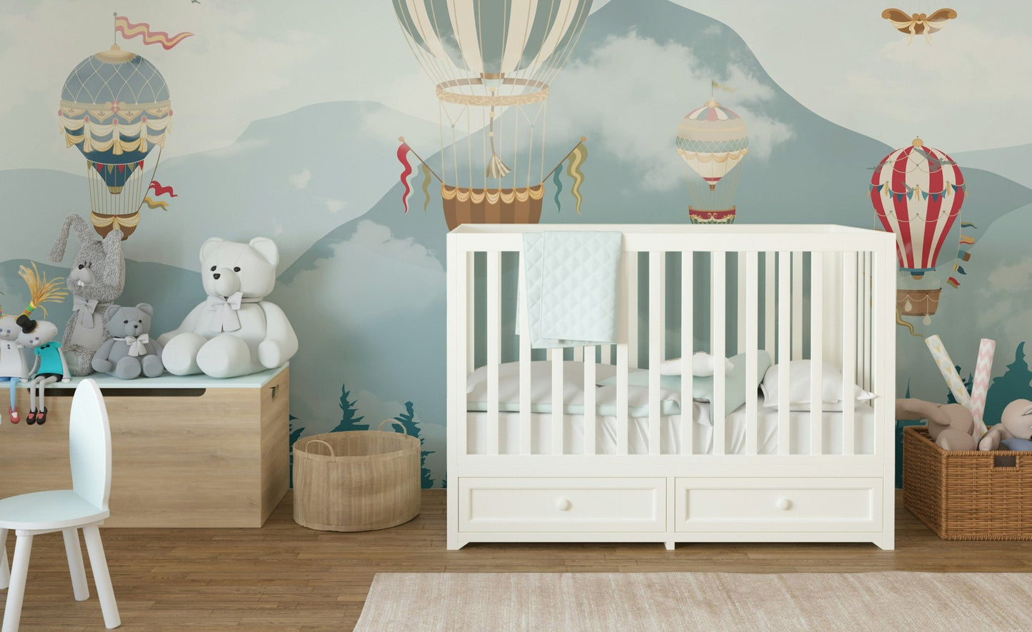 Teal forest wall mural in a baby room with mountain and balloons.