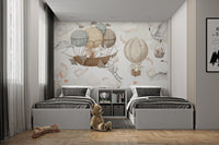 Floating ships and balloons mural with adorable animals in twin bedroom.