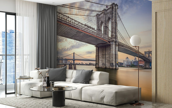 City skyline bridge wallpaper mural in a contemporary living room with a white sofa.