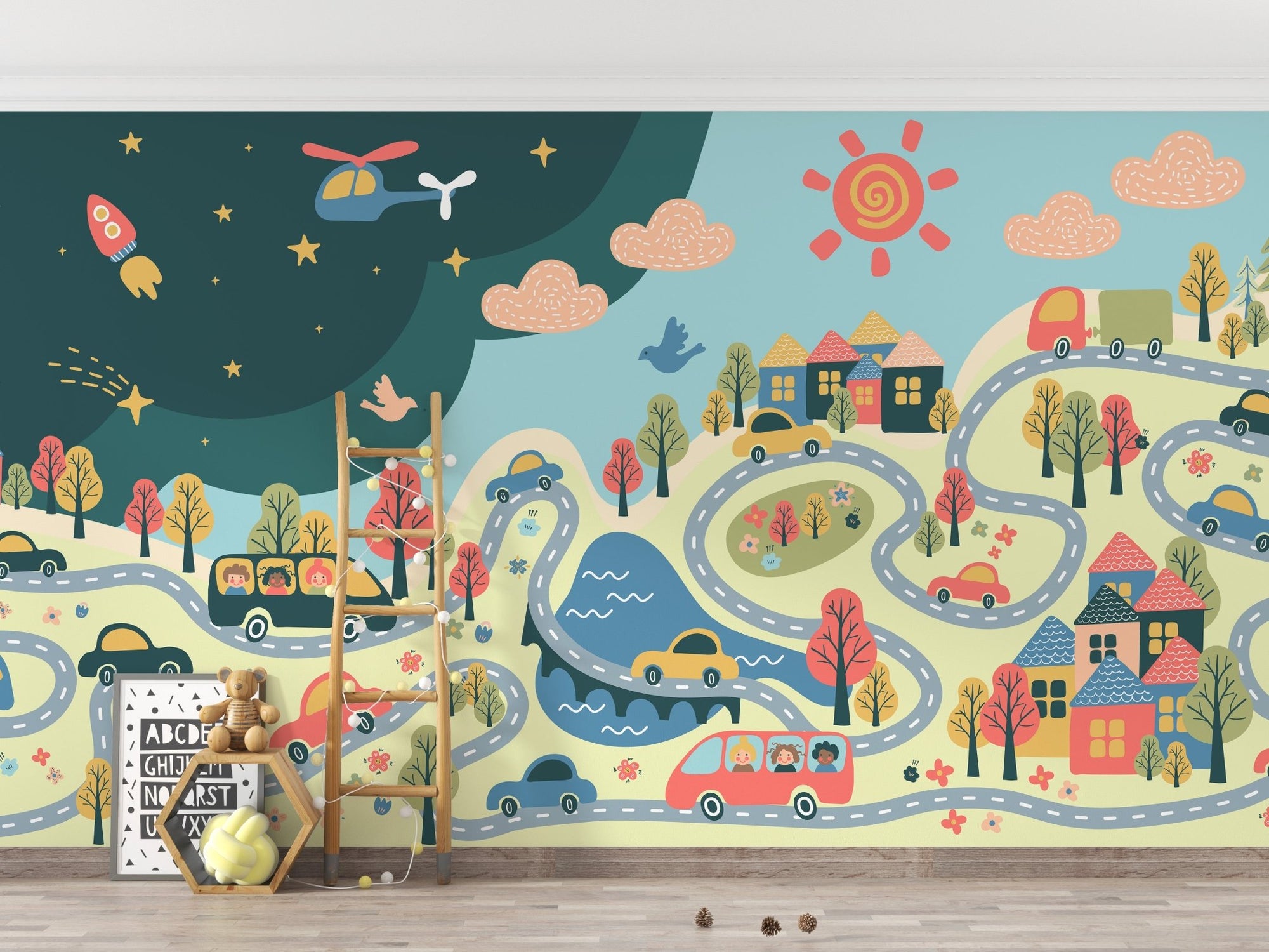 Cartoon city wall mural with winding roads and toy cars in a playroom.