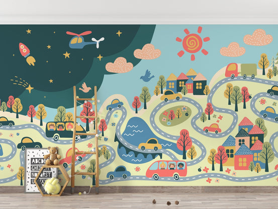 Cartoon city wall mural with winding roads and toy cars in a playroom.