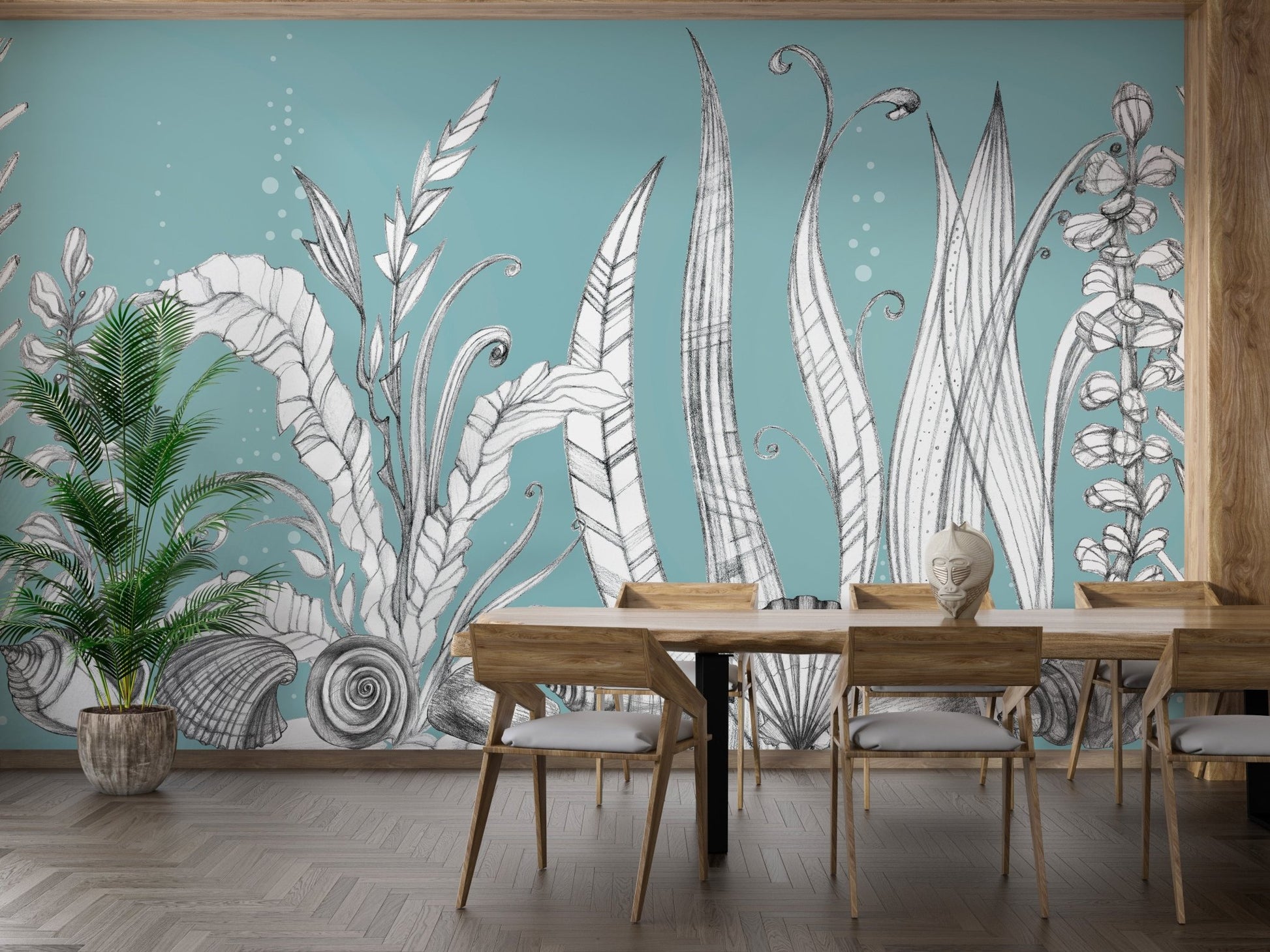 Teal botanical floral wall mural in a dining room with black legged chairs.