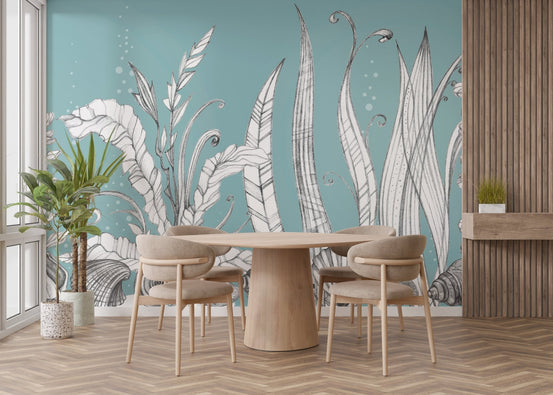 Teal floral wall mural in a modern dining room with a round oak table.