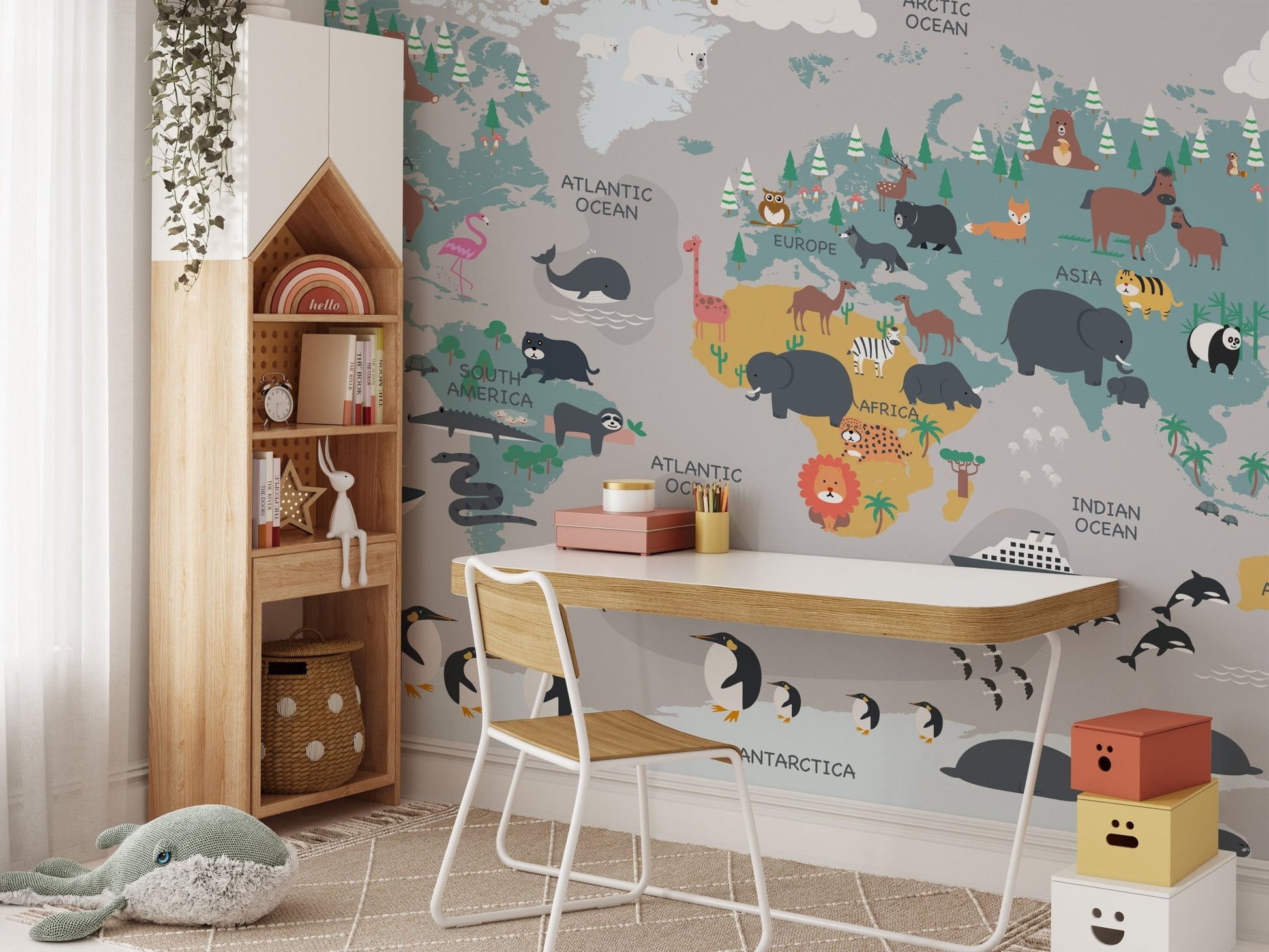 Animal map wall mural for a children's study desk area.