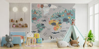 Animal world map wall mural in a bright kids playroom.