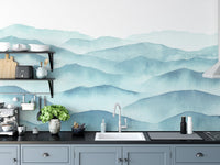 Modern kitchen featuring a blue watercolor mountain wall mural.