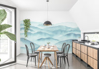 Bright dining area with a blue mountain range wall mural.