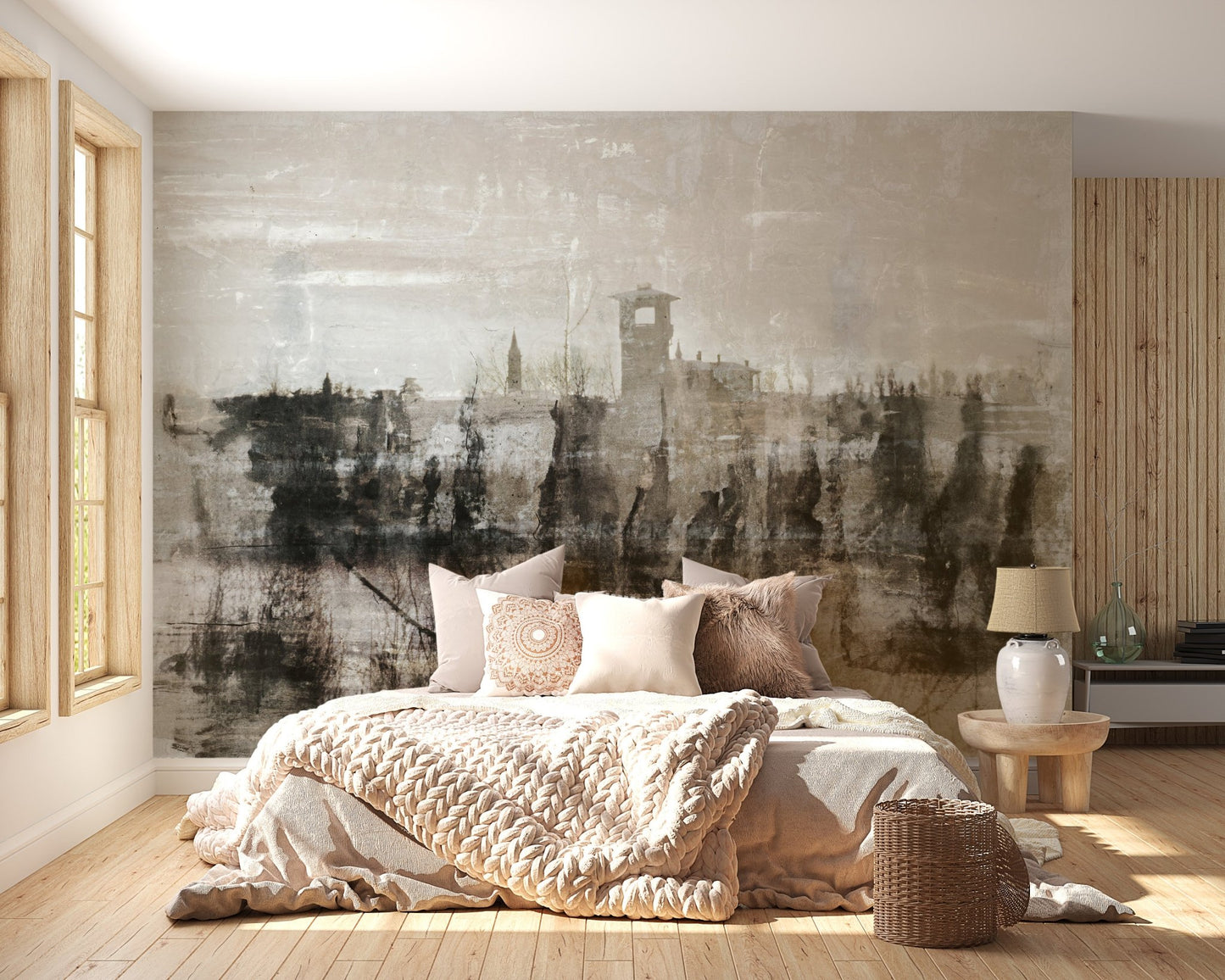 Light beige bedding in a bedroom featuring a landscape ruins wall mural.