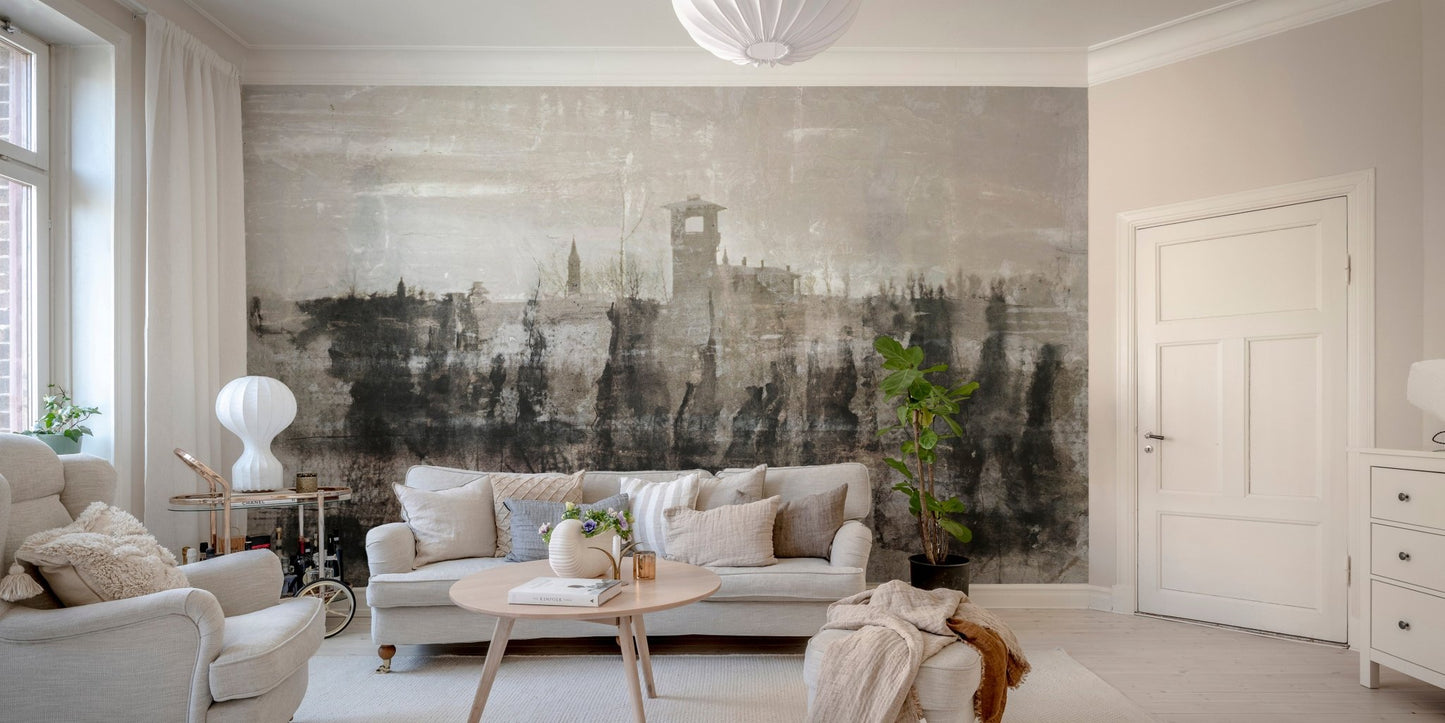 Expressive black-and-white ruins mural in living area.