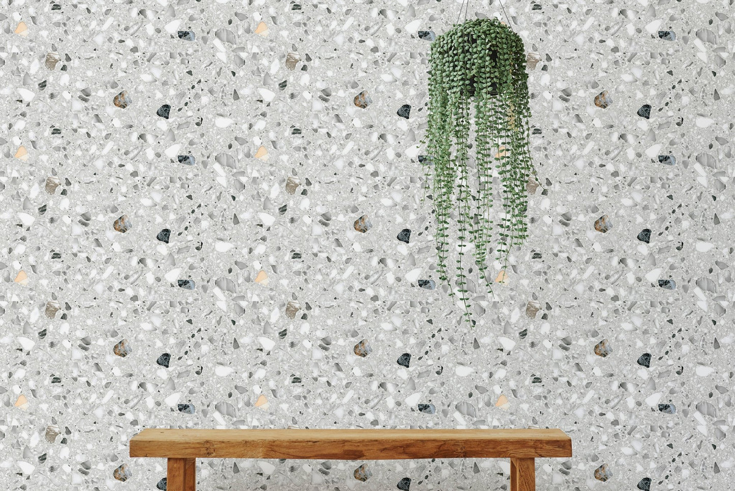 Italian style terrazzo flooring vector grey wallpaper behind a wooden bench and plant.