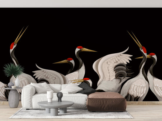 White sectional sofa against a black crane wall mural in a modern lounge.