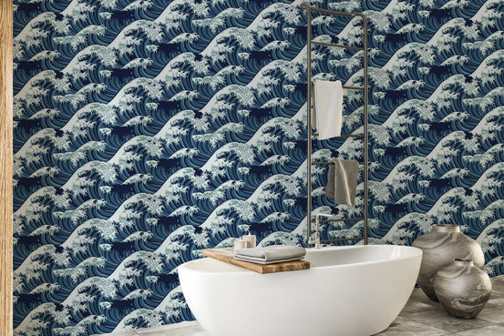 Japanese wave pattern wallpaper behind a white freestanding bathtub.