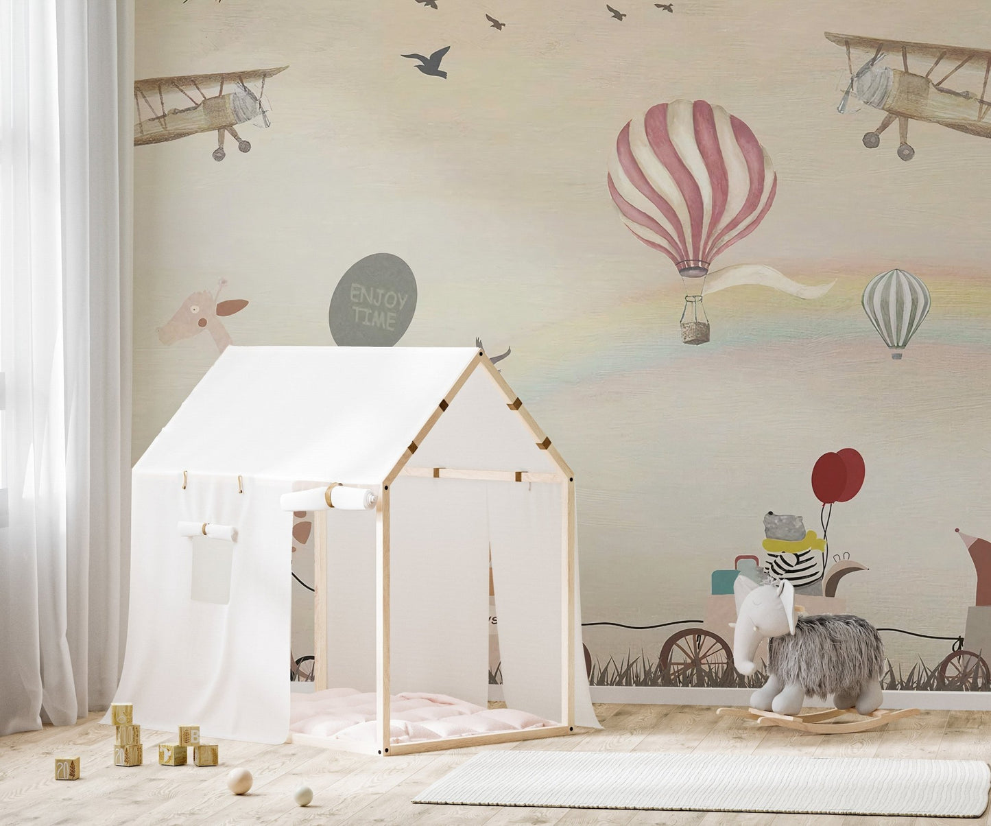 Play area wall mural with animal parade and a white house-shaped tent.