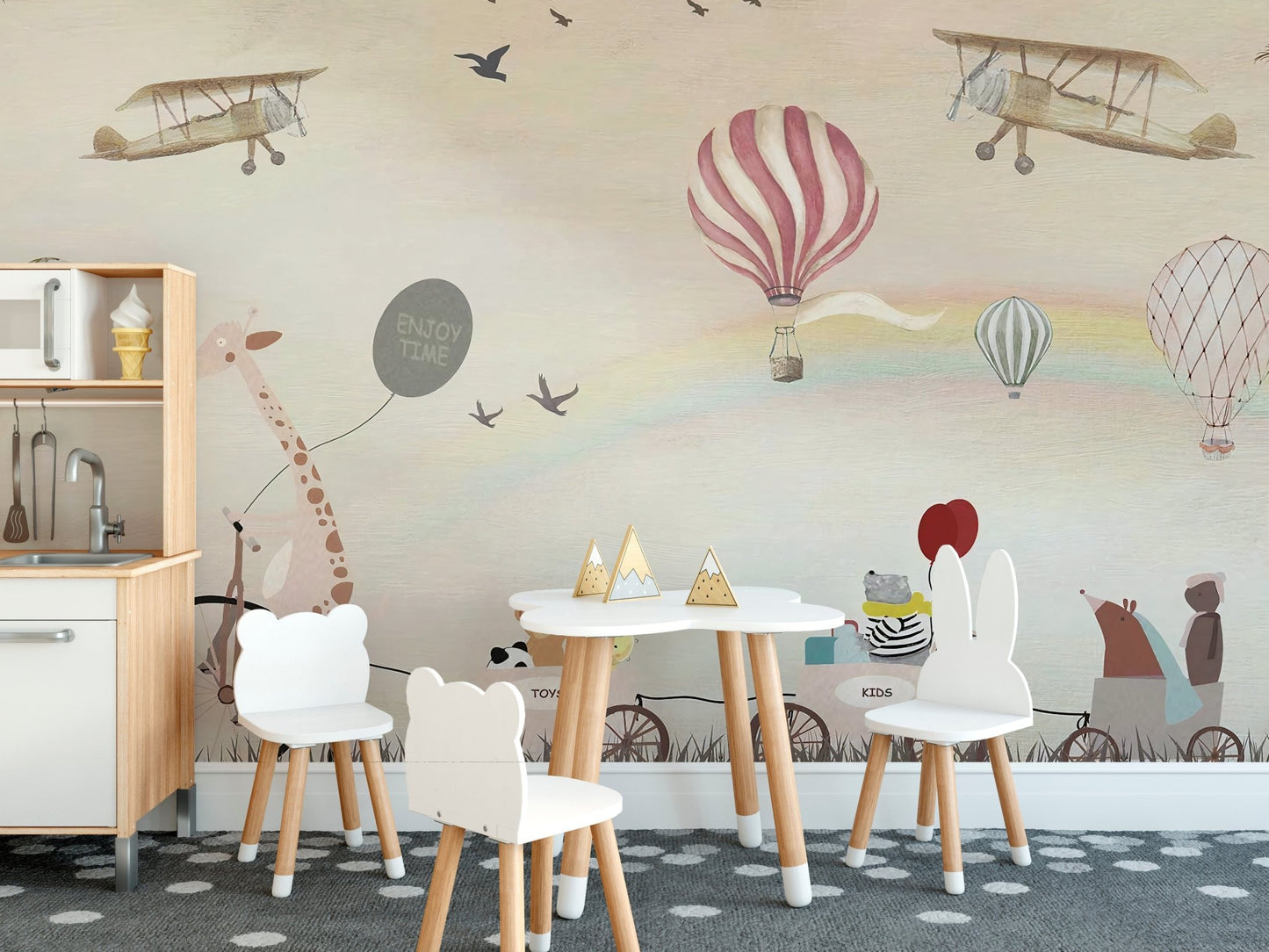 Jovial Animal Parade wall mural used in a nursery with small white chairs.