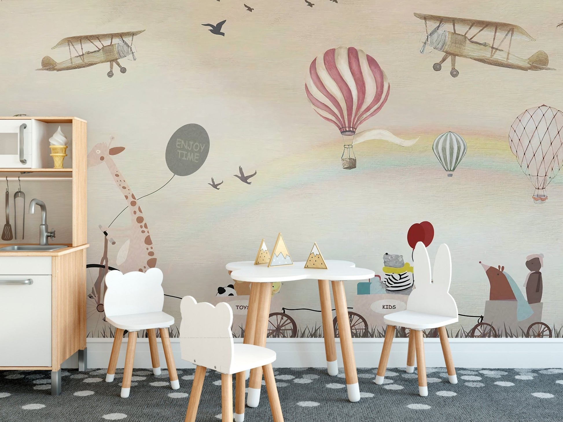 Jovial Animal Parade wall mural used in a nursery with small white chairs.