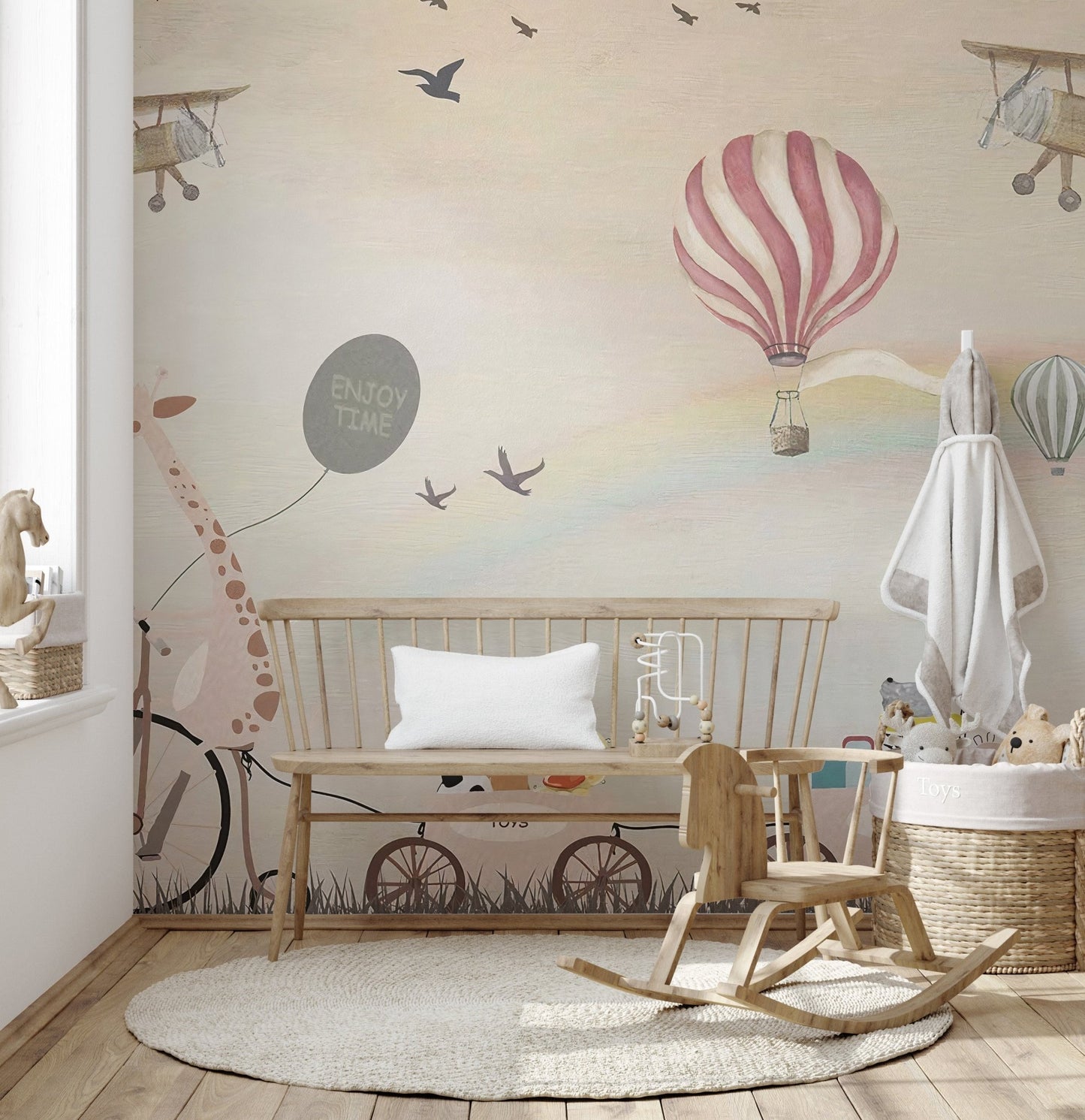 Kids room wall mural showing animal parade and rocking horse.