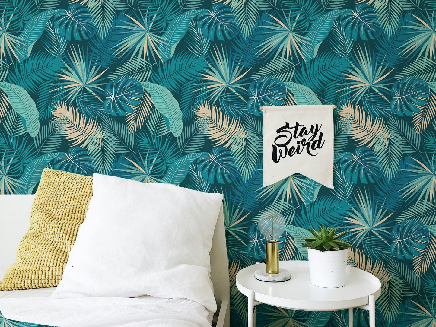 Bedroom accent wall using dark green palm leaf wallpaper.