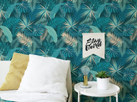 Bedroom accent wall using dark green palm leaf wallpaper.
