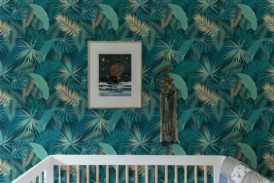 Teal jungle palm leaves wallpaper in a modern bedroom setting.
