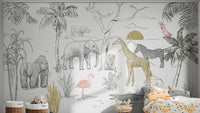 Jungle wall mural with a sunset behind giraffes and elephants in bedroom.